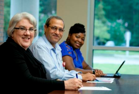 Three Extension employees - smiling Three Extension employees - smiling